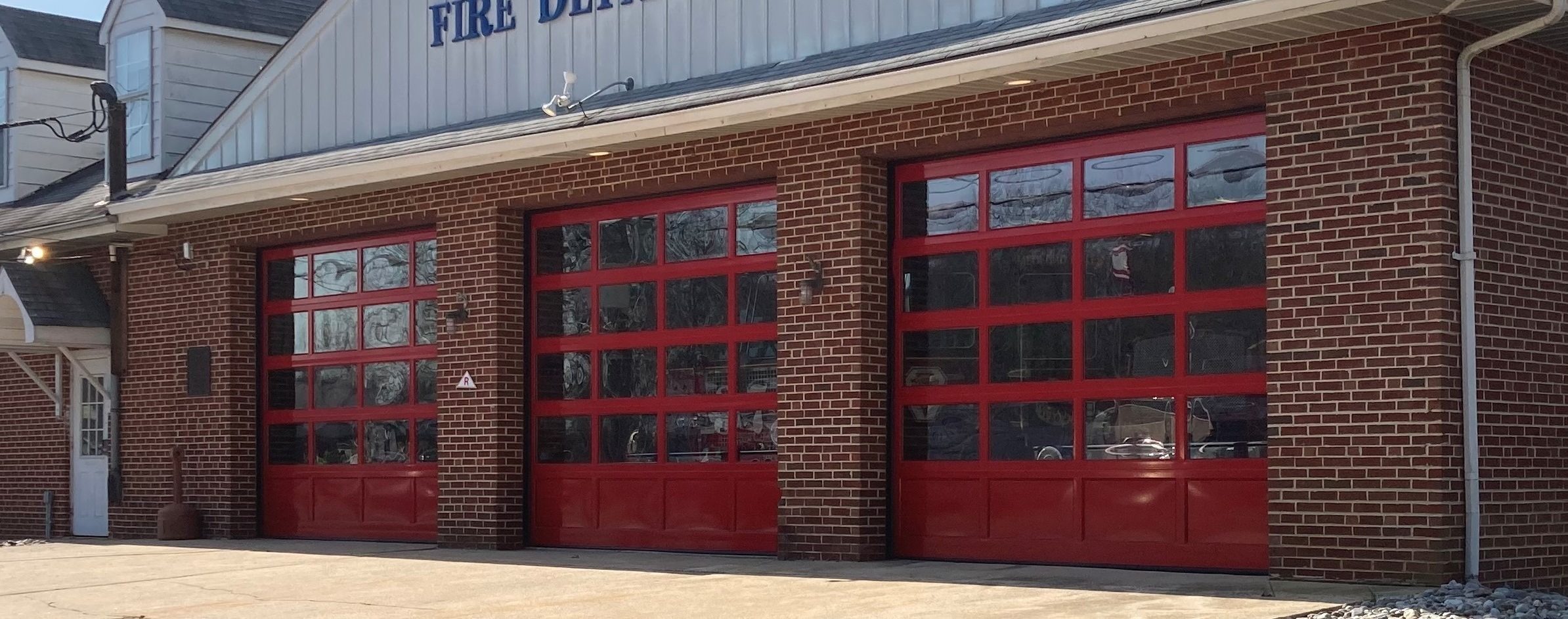 Fire house glass garage doors with red frame